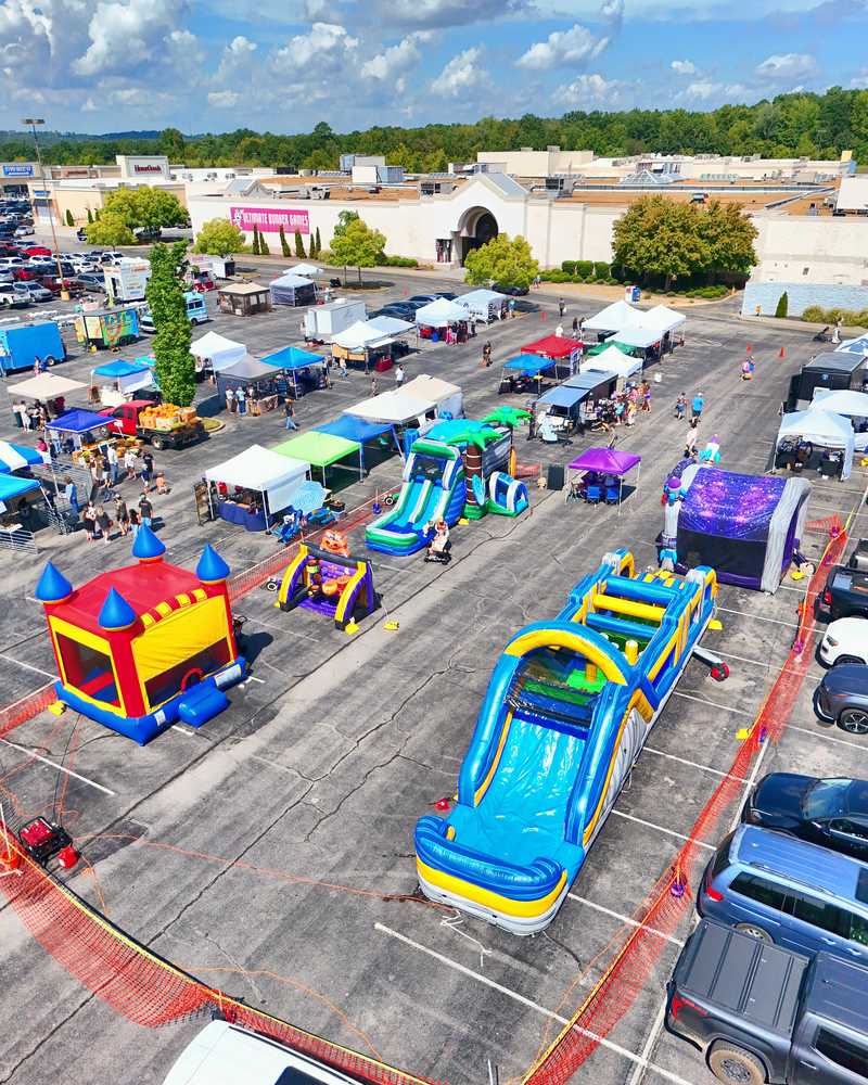 Monkey Town inflatables set up at a community event
